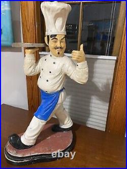 Restaurant Decoration. Pizza Chef Statue with Pizza Plate
